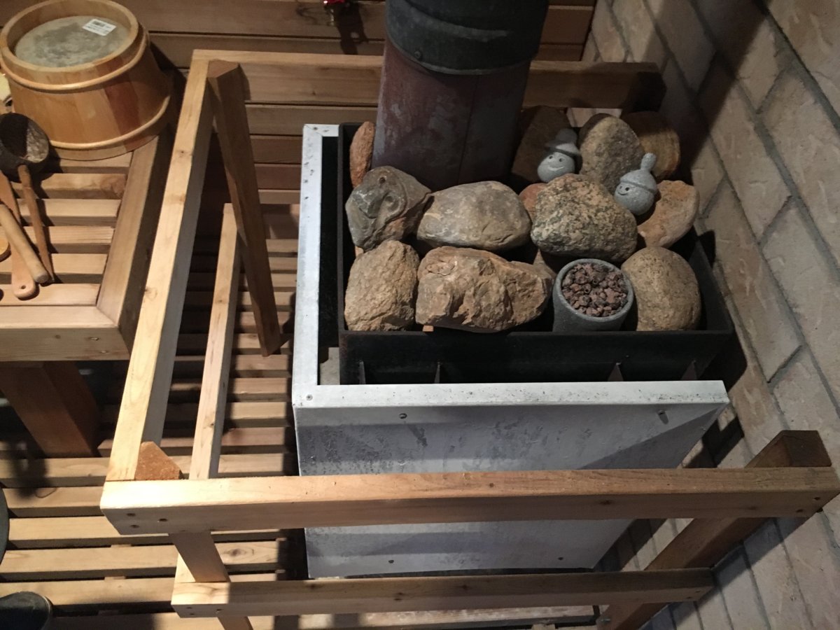 Can I convert an electric sauna to use a wood sauna stove?